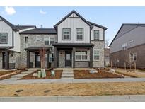 Charming two-story home with stone accents and a covered front porch at 741 N Tibet St, Aurora, CO 80018