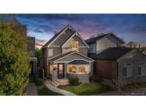 Charming home featuring a walkway, quaint bay window and a well-manicured lawn at 1832 W 36Th Ave, Denver, CO 80211