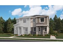 New two-story home featuring stone accents, neutral siding, manicured lawn, and professional landscaping at 24088 E Warm Springs Ave, Aurora, CO 80019