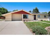 Charming single-story home featuring a well-maintained front yard, attached garage, and neutral exterior paint at 5067 S Mabre Ct, Littleton, CO 80123