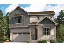 Charming two-story home featuring a covered porch, two-car garage, and landscaped yard at 45927 Wood Thrush Ave, Bennett, CO 80102