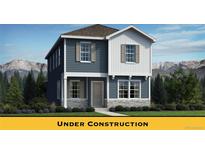Charming two-story home featuring a modern exterior with blue siding and a stone foundation accent at 834 N Bently St, Watkins, CO 80137