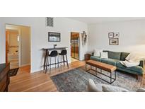 Cozy living room featuring modern furnishings, stylish decor, and hardwood floors at 701 S Roosevelt Ave, Lafayette, CO 80026