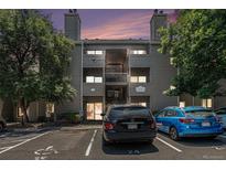 Apartment complex featuring a light gray color scheme and convenient parking at 3600 S Pierce St # 2-201, Lakewood, CO 80235