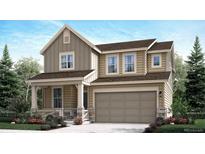 Two-story house featuring a beige exterior, stone accents, and a two-car garage at 250 Paloma Way, Elizabeth, CO 80107