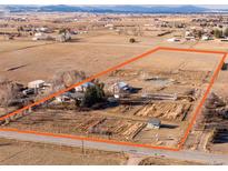 Gorgeous aerial view of the property outlining a lush, expansive lot with well-maintained landscaping at 3428 W County Road 4, Berthoud, CO 80513