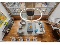 Bright living room featuring an overhead view, modern chandelier, and hardwood floors at 1050 Cherokee St # 403, Denver, CO 80204