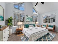 Bright bedroom with vaulted ceiling, multiple windows, and tasteful decor create an airy and inviting atmosphere at 12525 E Tennessee Cir # E, Aurora, CO 80012