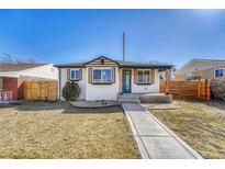 Charming home featuring a well-maintained front yard and a welcoming exterior at 1328 Holly St, Denver, CO 80220