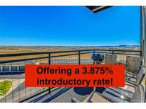 Enjoy beautiful views from this spacious balcony with plenty of room for outdoor dining and relaxation at 13598 Via Varra # 301, Broomfield, CO 80020