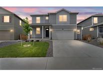 Charming two-story home features a landscaped front yard and inviting curb appeal at 2351 Monte Vista St, Fort Lupton, CO 80621