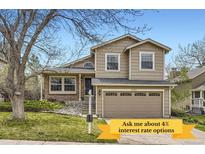 Charming two-story home featuring a well-maintained lawn, brick accents, and an attached two-car garage at 6382 Freeport Dr, Highlands Ranch, CO 80130