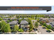 Street view of modern homes in a well maintained community neighborhood with mature trees at 9154 E 37Th Ave, Denver, CO 80238