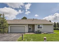 Charming single-story home with a well-maintained front yard and attached garage at 13940 E Linvale Pl, Aurora, CO 80014