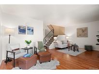 Bright living room with hardwood floors, plush seating, and elegant decor at 544 Vance St, Lakewood, CO 80226