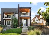 Striking modern two-story home with a brick facade, wood accents, and a well-manicured front yard at 3617 Shoshone St, Denver, CO 80211