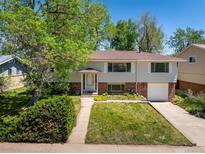Charming split-level home with a well-manicured front yard and classic architectural details at 1270 Berea Dr, Boulder, CO 80305