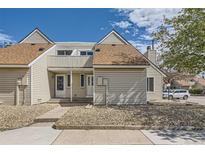 Charming townhome with light siding, well-maintained landscaping, and a welcoming entrance at 2469 S Xanadu Way # A, Aurora, CO 80014