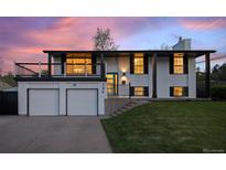 Charming two-story home with a two-car garage, balcony, and landscaped front yard at 794 W Elati Cir, Littleton, CO 80120