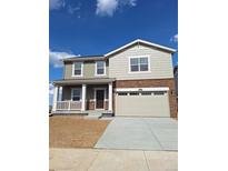 Beautiful two-story home featuring a welcoming front porch and attached two-car garage at 15296 Fillmore St, Thornton, CO 80602