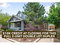 Charming gray duplex featuring a welcoming front porch, landscaped yard, and mature trees in a desirable neighborhood at 1518-1520 S Sherman St, Denver, CO 80210