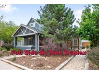 Charming side-by-side duplex with inviting front porch and professionally landscaped front yard at 1518-1520 S Sherman St, Denver, CO 80210