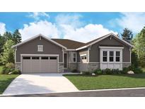 Charming single-story home featuring a two-car garage, stone accents, and meticulous landscaping at 5602 Riverbend Ave, Firestone, CO 80504