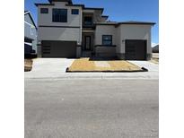 Two-story home with a two-car garage and a low-maintenance yard at 898 Coal Bank Trl, Castle Rock, CO 80104
