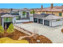 Stunning new construction home with a three-car garage and modern architecture at 8132 Galileo Way, Littleton, CO 80125
