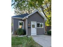 Charming home with gray siding, a white door, and neatly trimmed landscaping adding to its curb appeal at 4344 Chase St, Denver, CO 80212