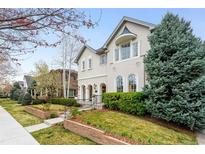 Elegant home with landscaped front yard, mature trees, and charming curb appeal at 1164 S High St, Denver, CO 80210