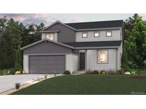 Charming two-story home with a well-manicured lawn and attached two-car garage at 1310 Loraine N Cir, Lafayette, CO 80026