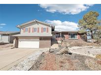 Charming two-story home with red shutters, brick accents, and a well-maintained front yard at 12097 E Mexico Ave, Aurora, CO 80012