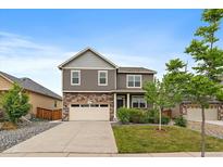 Charming two-story home with a well-maintained front yard and an attached two-car garage at 1181 W 170Th Ave, Broomfield, CO 80023