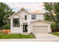 Stunning two-story home features manicured lawn, attached two car garage, and sophisticated design at 2773 S Garfield St, Denver, CO 80210