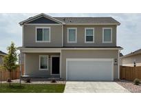 Charming two-story home with a two car garage, neutral siding, and well-maintained lawn at 2174 Alyssa St, Fort Lupton, CO 80621