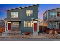 Contemporary home with modern design, blue siding, and red front door at 744 Grand Market Ave, Berthoud, CO 80513