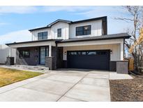 Charming two-story home boasting a modern facade, well-manicured lawn, and a spacious driveway at 3041 S Bellaire S St, Denver, CO 80222