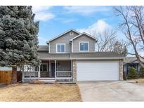 Charming two-story home featuring a stone-accented facade, covered porch, and attached two-car garage at 13124 Tejon St, Westminster, CO 80234