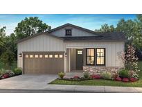 Charming single-story home featuring a stone accent, a two-car garage, and professionally landscaped front yard at 11126 Amber Light Cir, Littleton, CO 80125