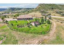 Stunning property featuring a sprawling lawn, mature trees, garden, and beautiful outdoor living space at 5285 E State Highway 86, Franktown, CO 80116