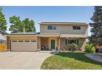 Charming two-story home featuring a manicured lawn, brick accents, and a convenient two-car garage at 6121 W 108Th Ave, Westminster, CO 80020