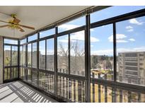 Bright sunroom featuring large windows with picturesque neighborhood views and natural light at 14001 E Marina Dr # 603, Aurora, CO 80014