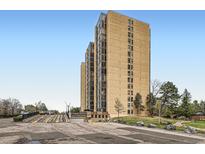 Contemporary apartment building with many windows and adjacent parking at 7865 E Mississippi Ave # 304, Denver, CO 80247