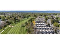 Stunning aerial view of condo community backing to golf course with mountain views at 6730 W 84Th Cir # 96, Arvada, CO 80003