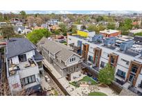 Stunning aerial view of the modern home with a well-manicured backyard and an inviting patio area at 1832 W 33Rd Ave, Denver, CO 80211