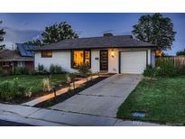 Charming single-story home with brick exterior, well-kept lawn, and inviting curb appeal at 40 Benton St, Lakewood, CO 80226
