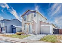 Charming two-story home with a well-manicured lawn and attached one car garage at 10129 Glencoe Ct, Thornton, CO 80229