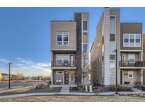 Modern townhome featuring a balcony and eye-catching architectural design at 15878 E Broncos Pl, Englewood, CO 80112