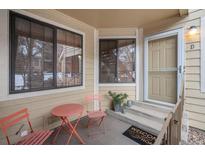 Condo exterior entrance with patio furniture at 4862 E Kentucky Ave # D, Denver, CO 80246